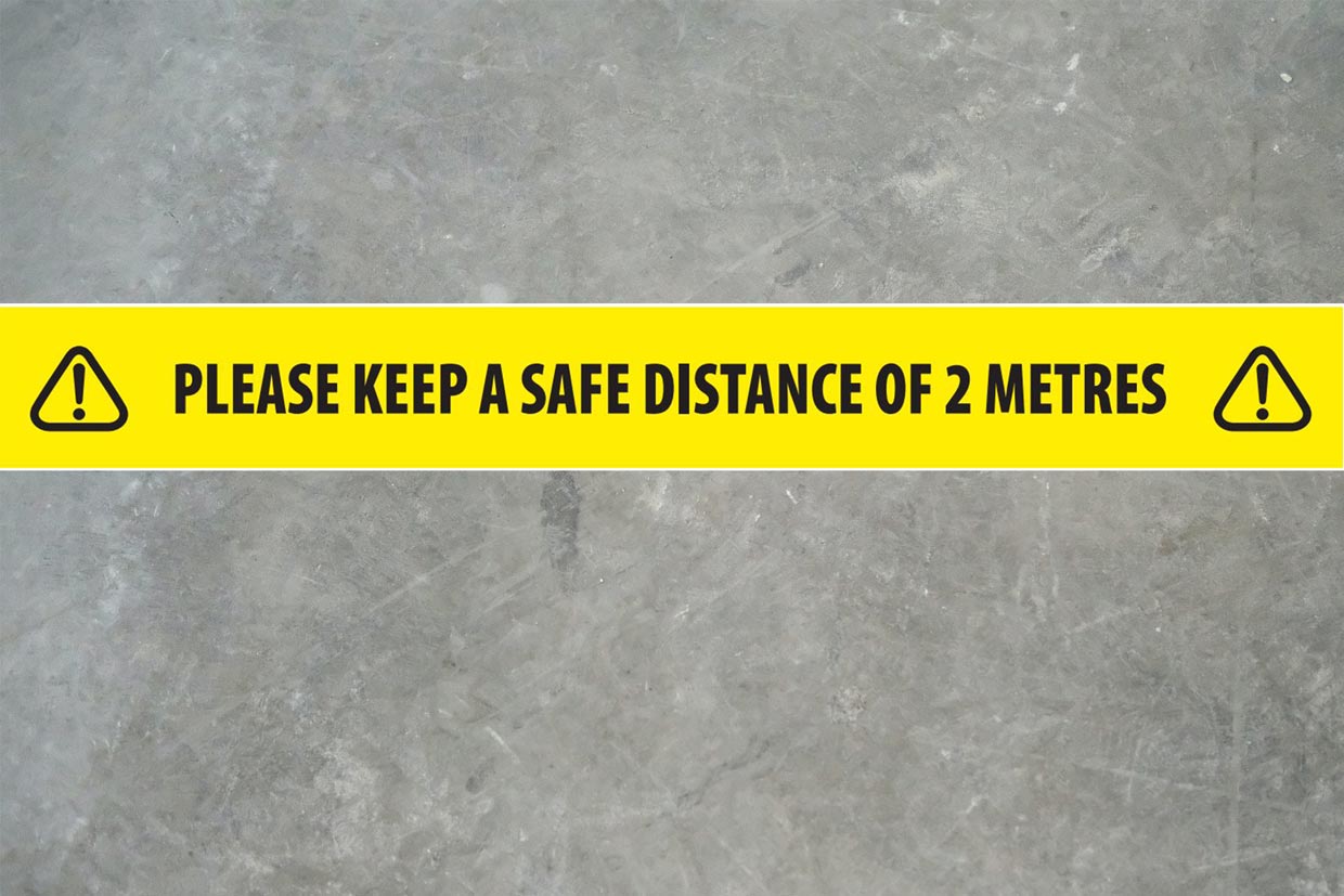 image of Social Distance Tape applied to a concrete floor